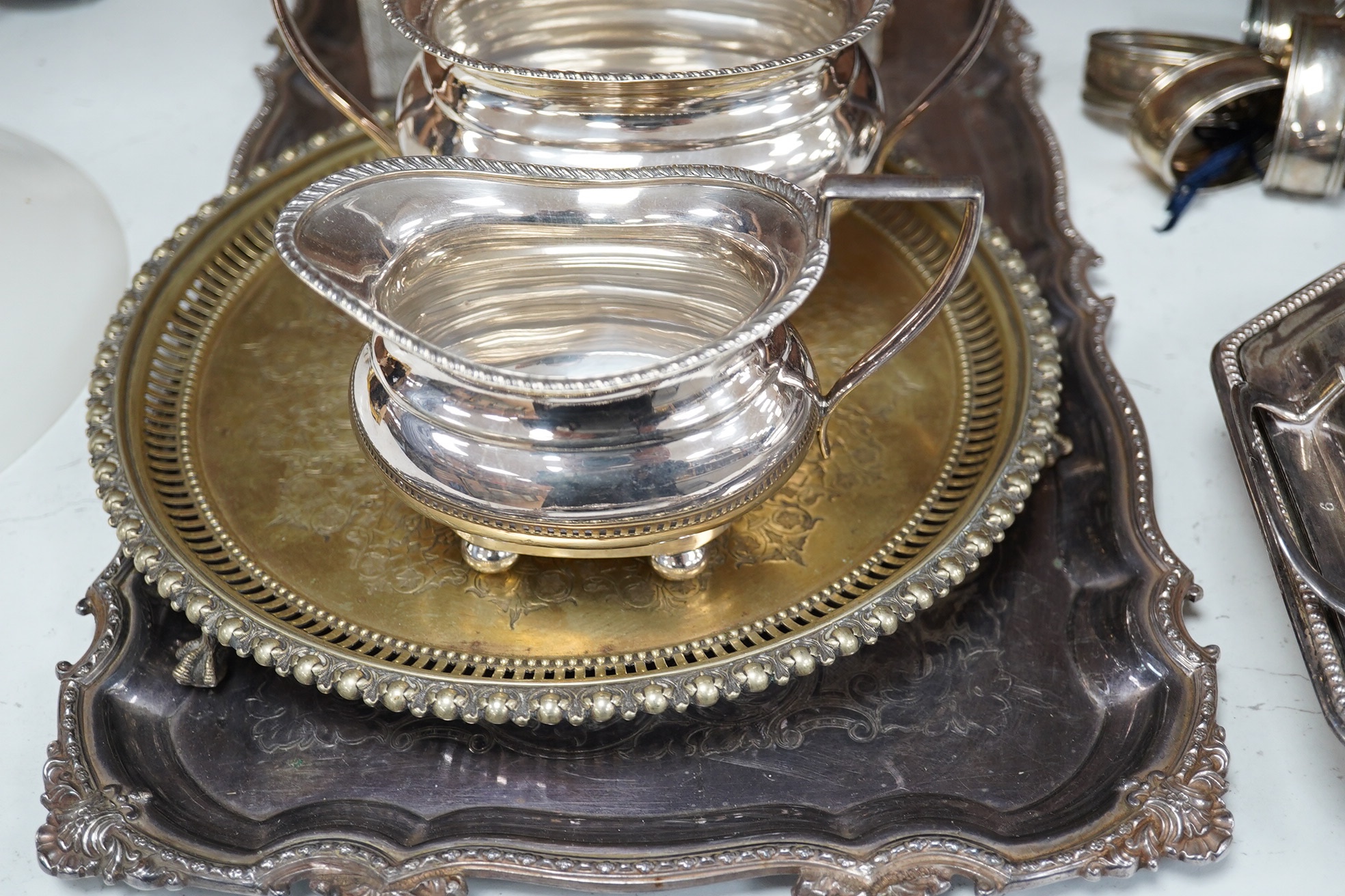 A quantity of plated wares including two entree dishes and covers, napkin rings, cream jug, trays, etc. Condition - fair